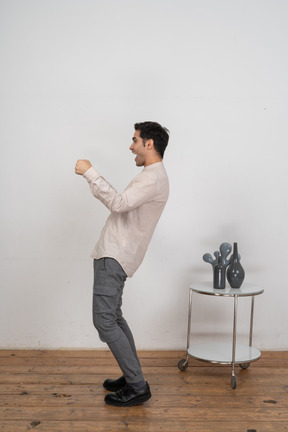 Happy man in shirt standing