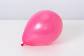 Pink balloon on a white background