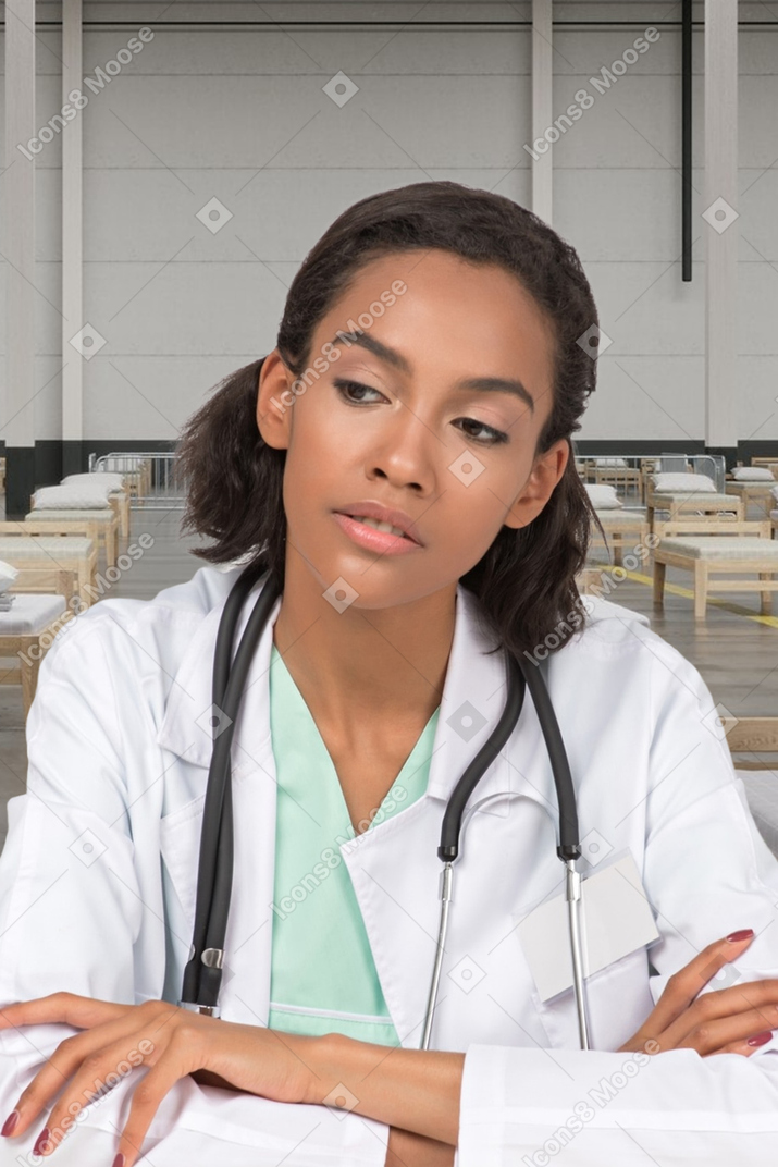 Woman doctor sitting and thinking