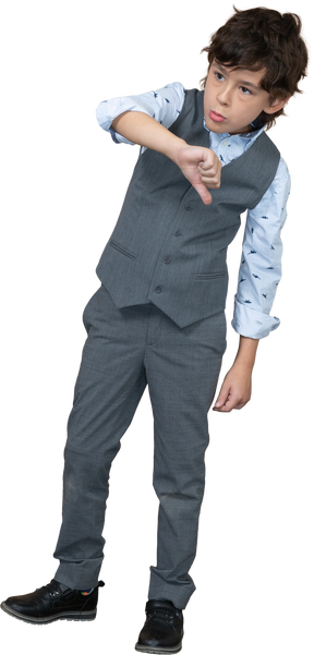 Front view of a boy in grey suit showing thumb down