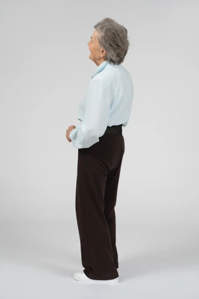 Back view of an old woman standing
