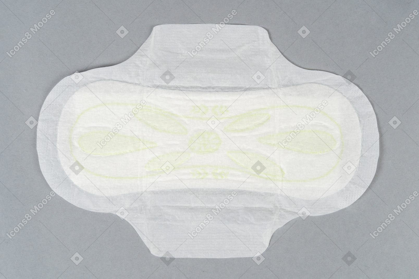 Sanitary pad with wings over gray background