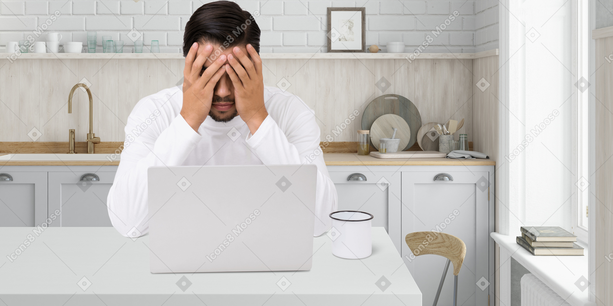 A man sitting in front of a laptop computer
