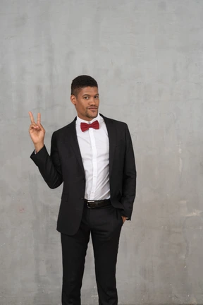 Man in black suit looking at camera