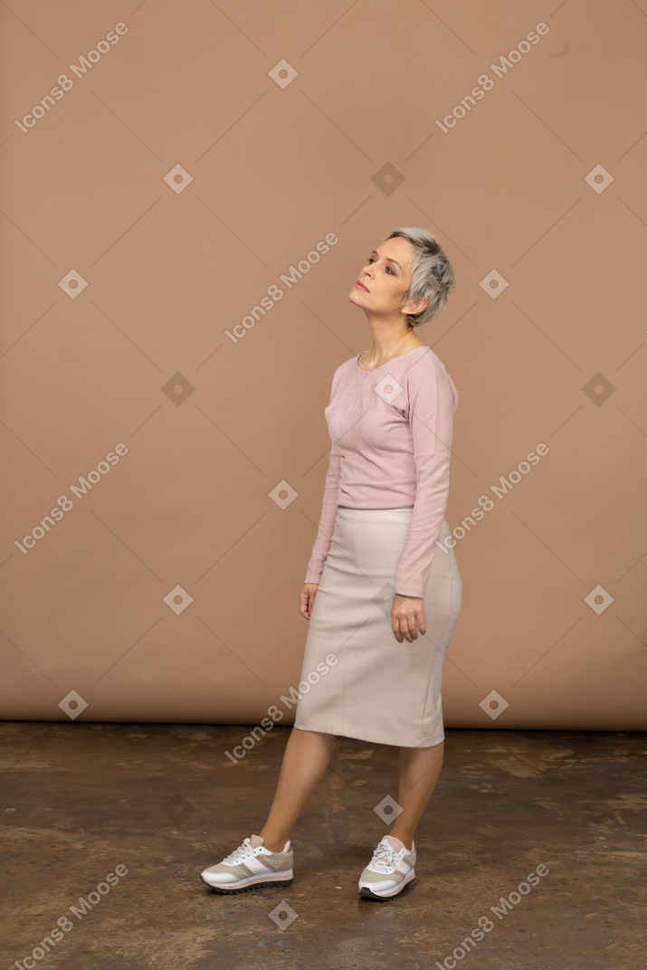 Side view of an upset woman in casual clothes looking up