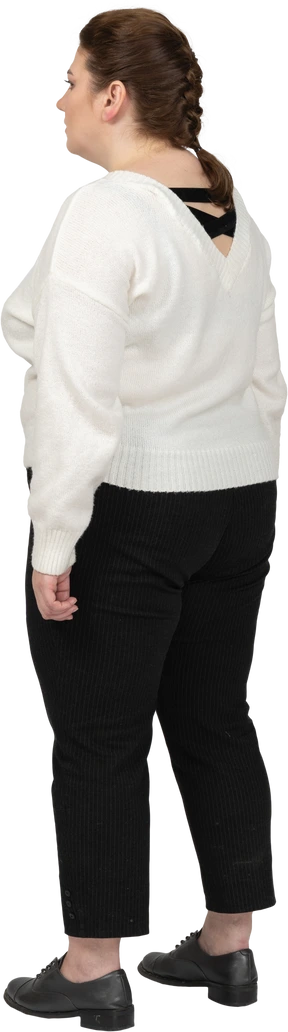 Plump woman in casual clothes standing
