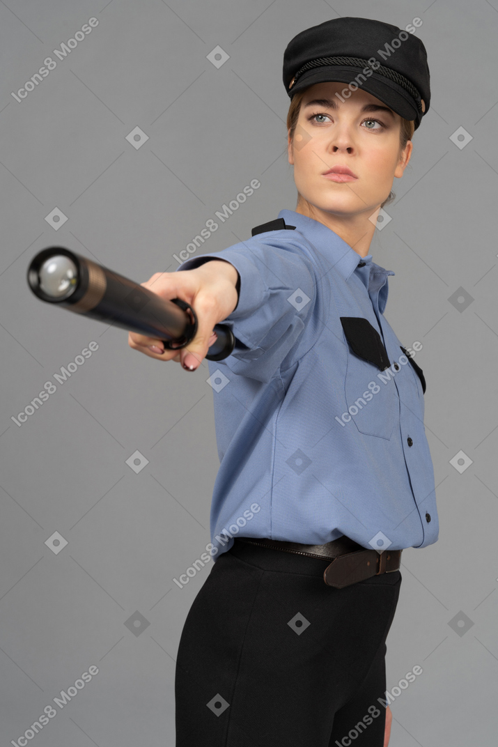 Female security guard with a baton