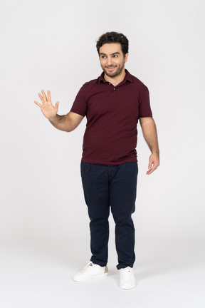 Smiling man showing five fingers