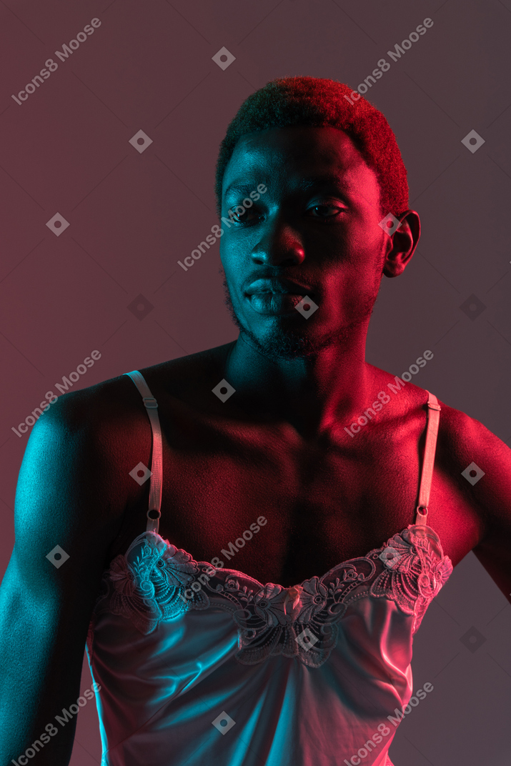 Black young man in nightie