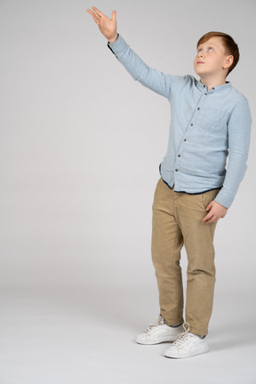 Boy pointing at something with hand