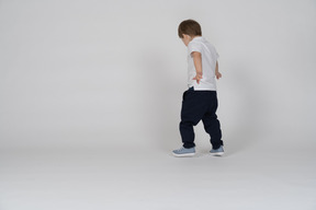 Back view of a child walking around