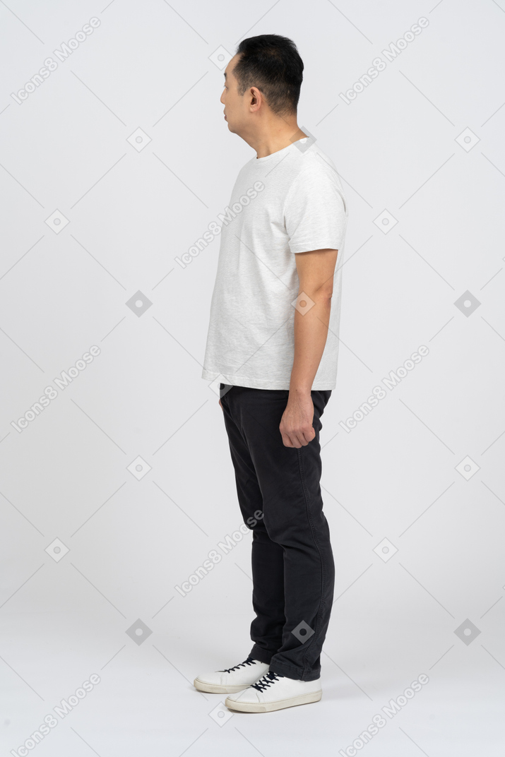 Side view of a man in casual clothes looking aside