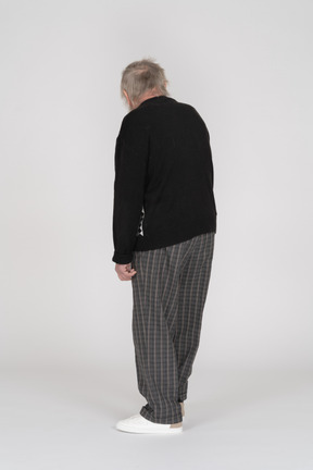 Back view of an old man in black sweater