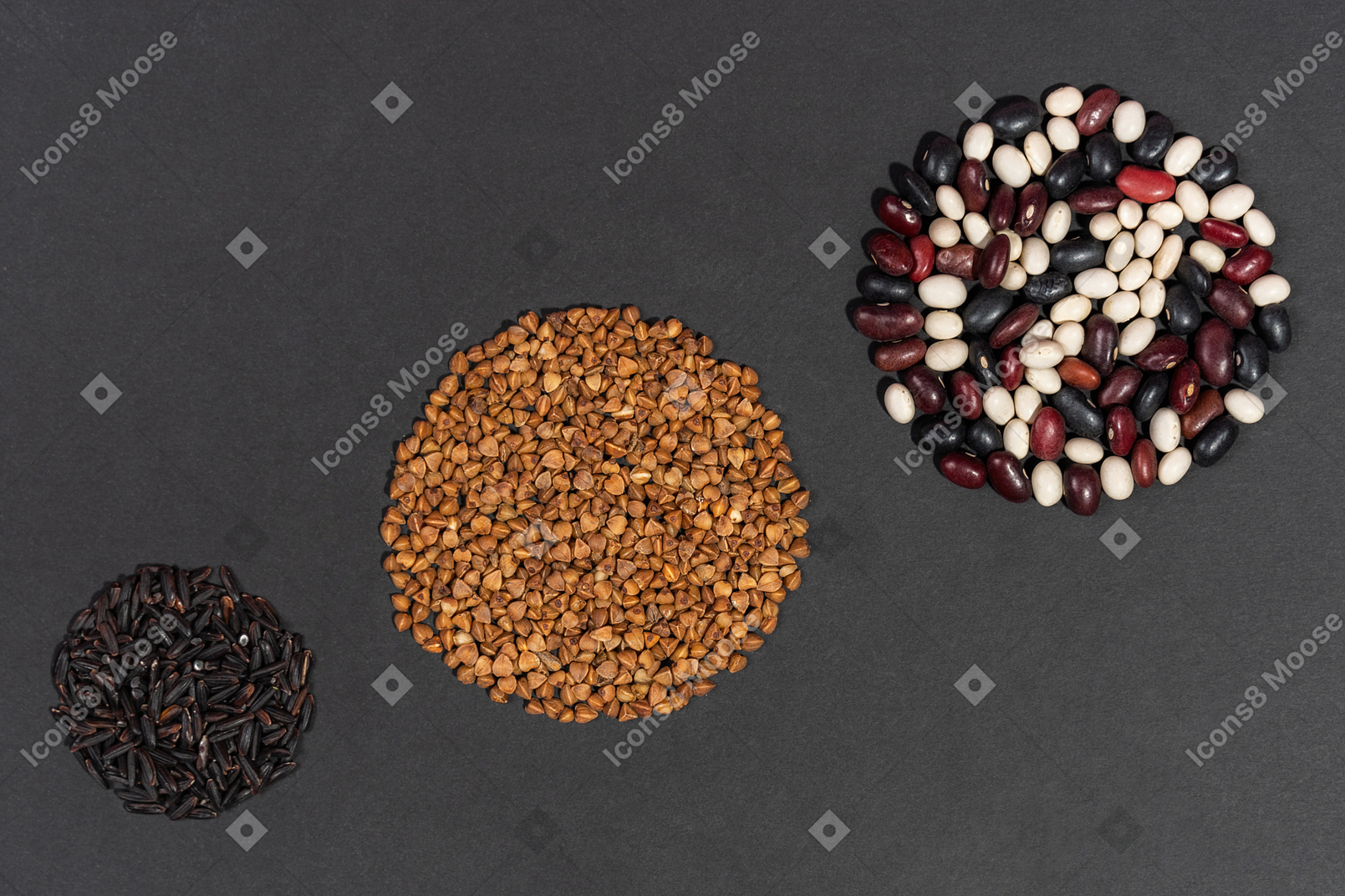 Three circles made of buckwheat black rice and multicolored beans