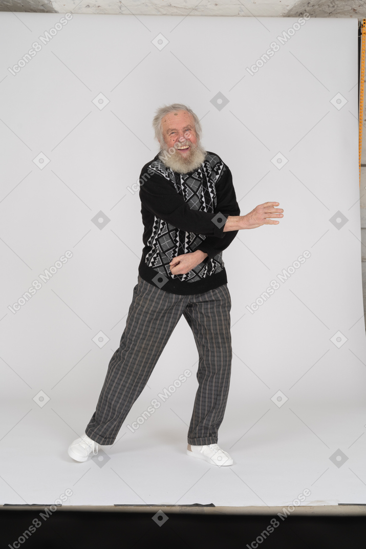 Cheerful old man dancing