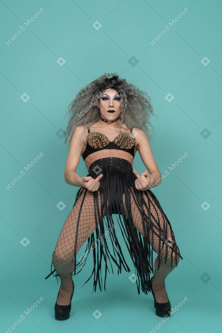 Drag queen showing middle fingers and leaning back