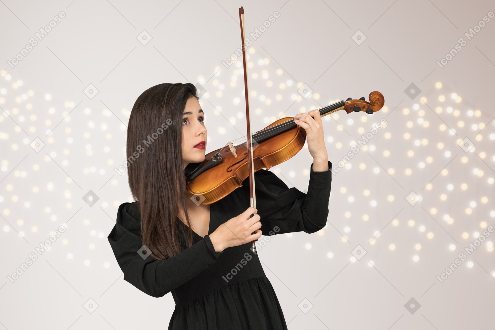 A woman in a black dress playing a violin