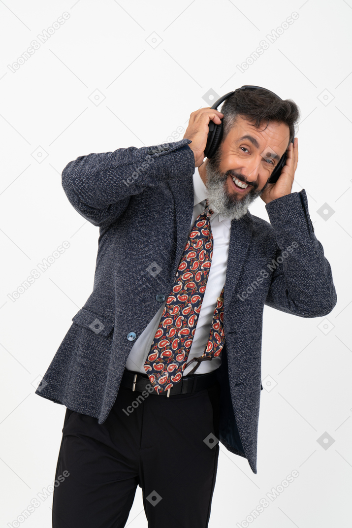 Happy man listening to  music in headphones