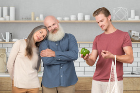 A family standing in a kitchen