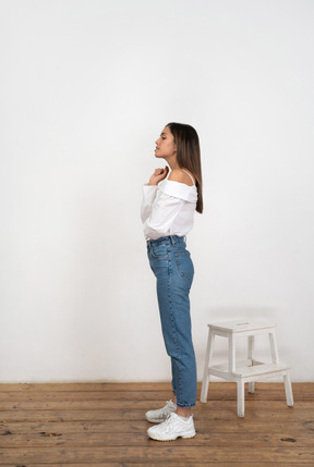 Side view of a young woman standing