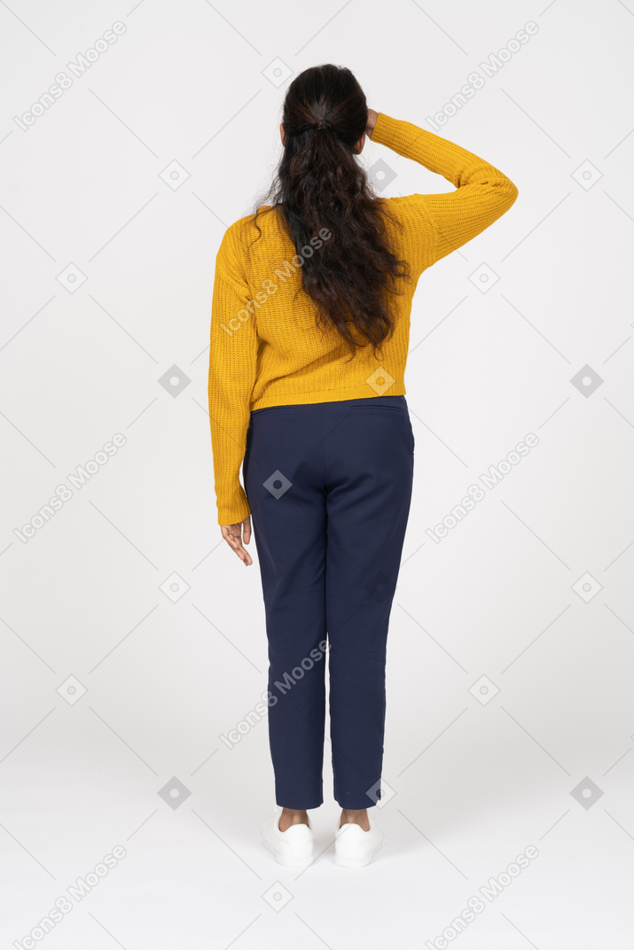 Rear view of a girl in casual clothes saluting with hand