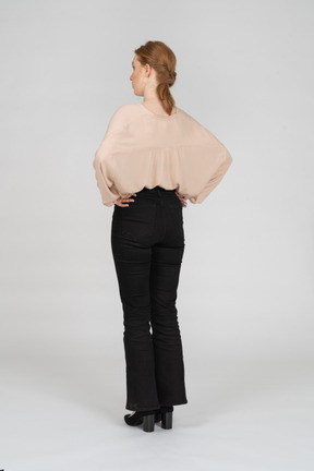 Woman in beautiful blouse standing