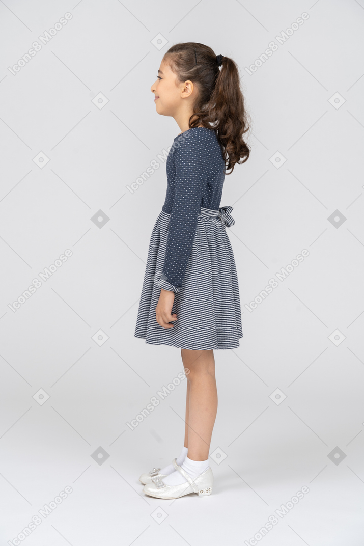 Side view of a girl smiling blissfully