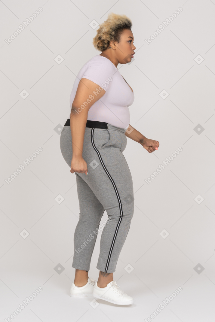 Plump black female walking sideways
