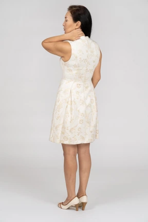 Woman in a white dress standing