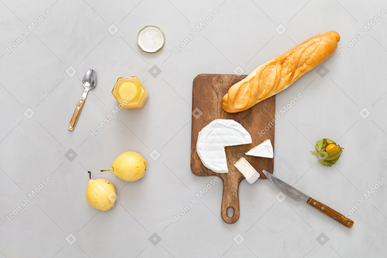 Cutting board with some baguette and cheese, some pears and honey