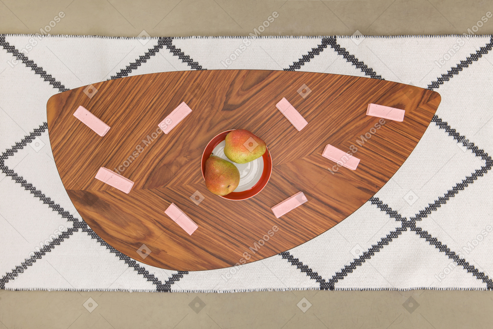 Pink marshmallows and two pears on a wooden coffee table, top view