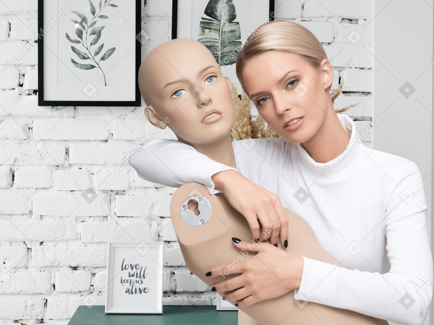 Woman in white top holding mannequin