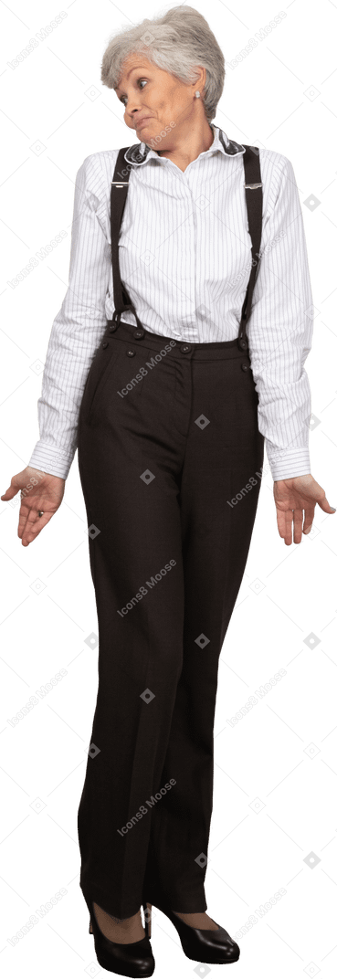 Front view of a shy old lady in office clothing outspreading hands