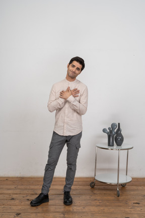 Confident man in shirt standing in front of camera