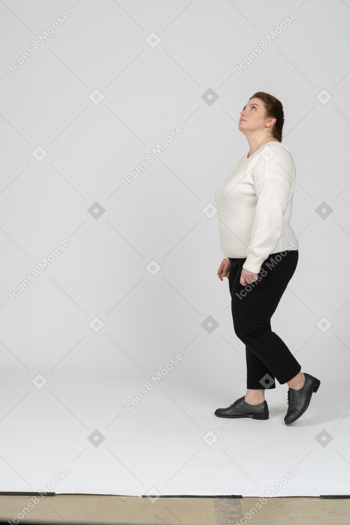 Side view of plump woman in casual clothes