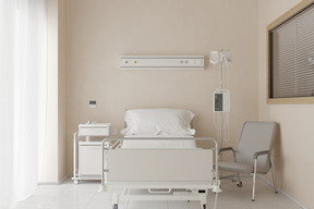 Chambre d'hôpital avec lit confortable et fauteuil