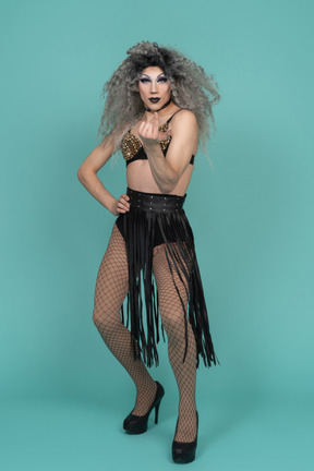 Front view of a drag queen beckoning
