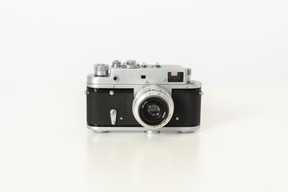 Photo camera on a white background