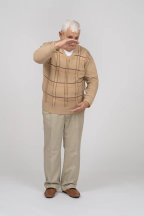 Front view of an old man showing size of something