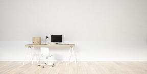 Bureau avec écran d'ordinateur debout contre un mur blanc