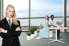 A person in a business suit standing in front of a group of people