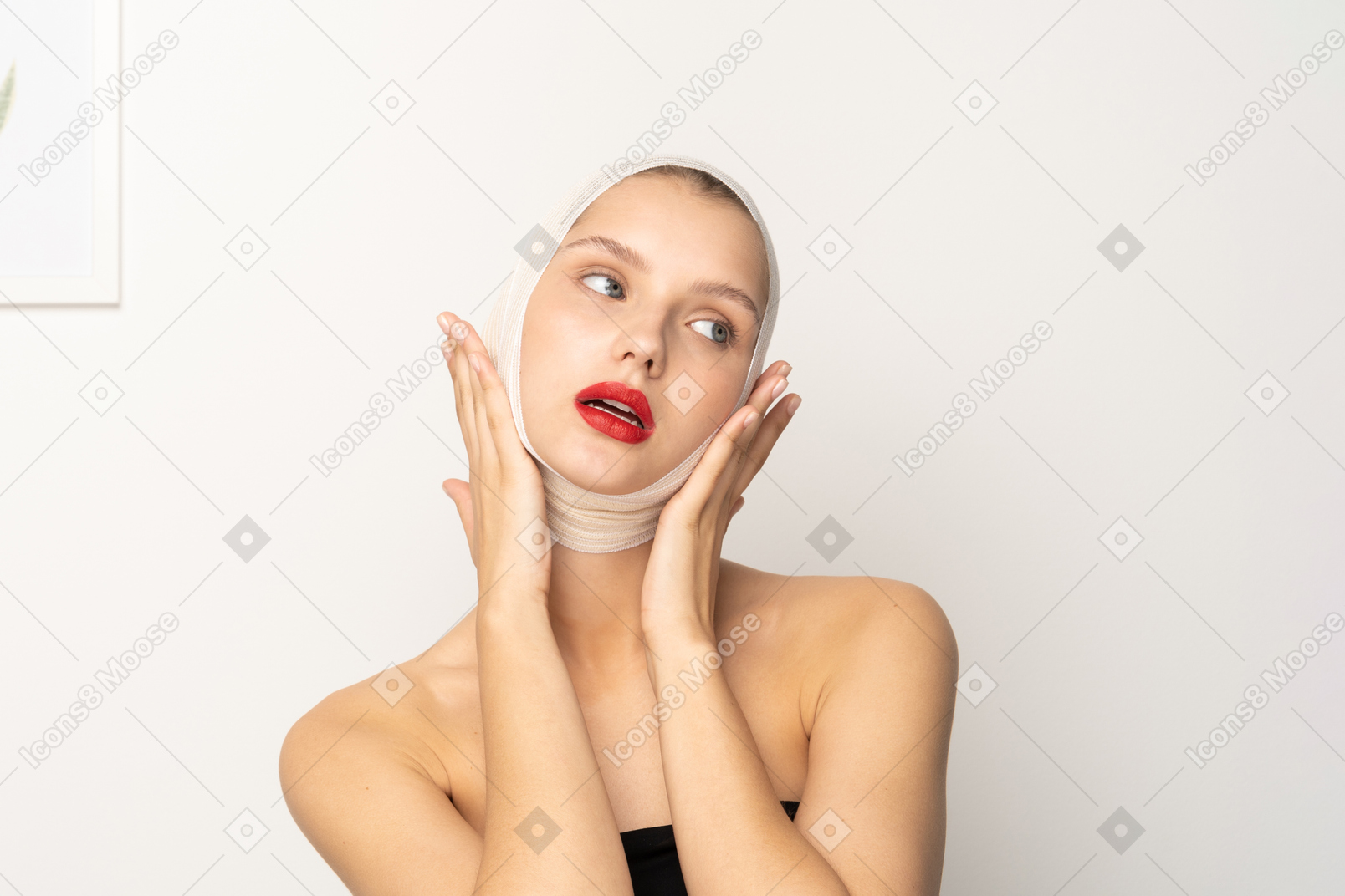 Young woman holding her face with both hands