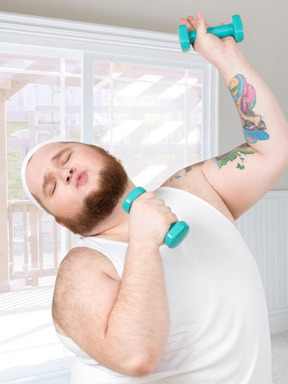 A fat man holding two dumbbells in his arms