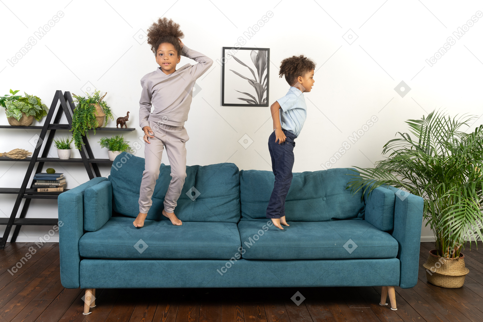 Good looking boy and girl play on the sofa