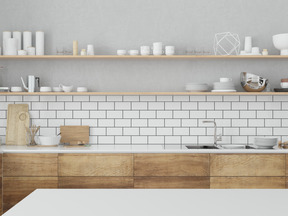 Kitchen with backsplash tiles and kitchen utencils