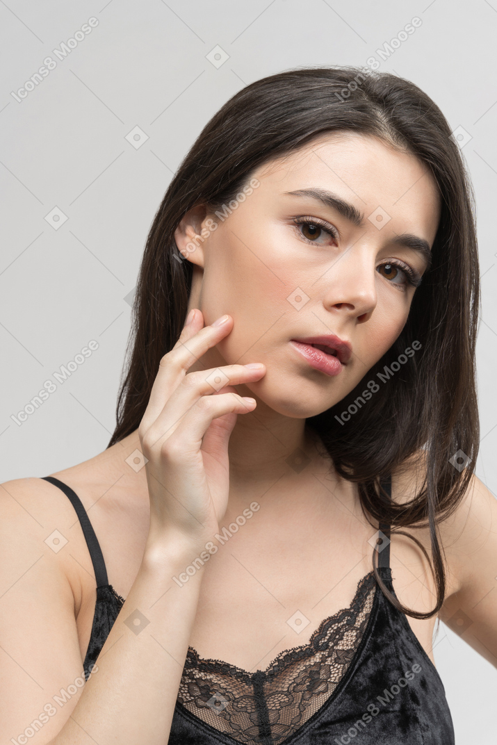 Thoughtful young woman facing the camera