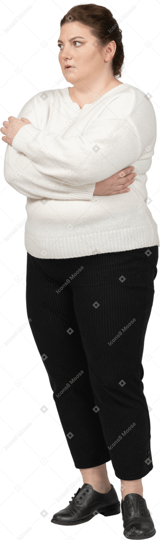 Plus size woman in casual clothes keeping arms crossed