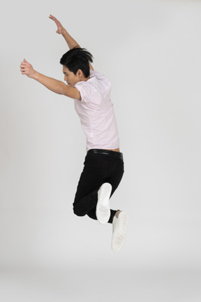 Man in casual clothes jumping