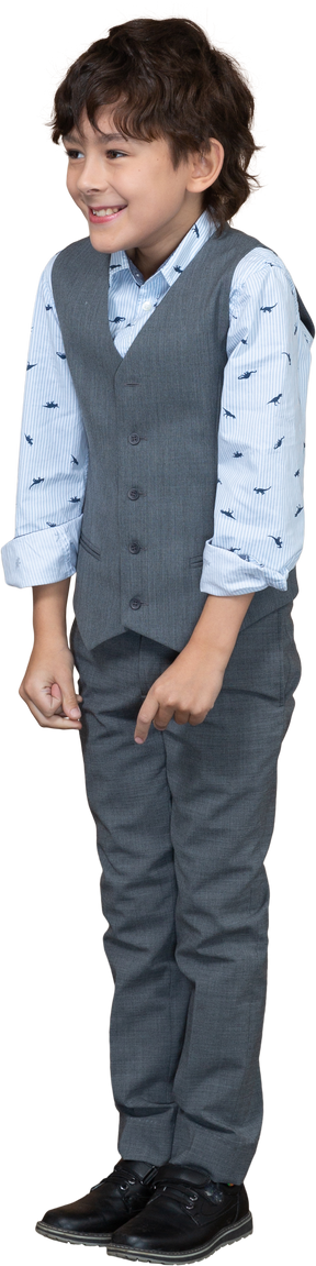 Front view of a happy boy in suit