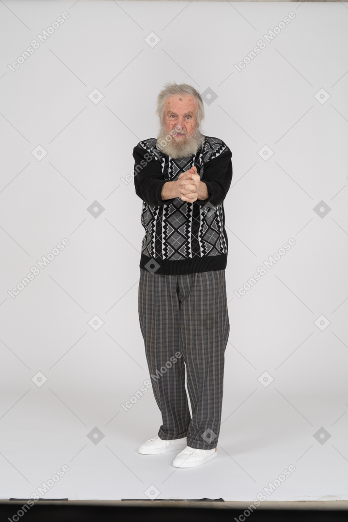 Old man shooting with finger gun